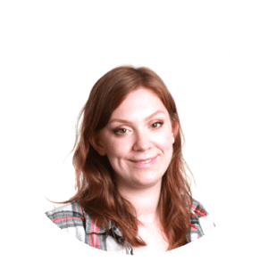 Ginger woman in plaid shirt.